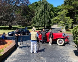 2022 Cruising New England with Paul Mennett 2022-07-10 2546 The Cruisin' New England film crew at work as Paul Mennett interviews Dick standing next to the 1929 Duesenberg.