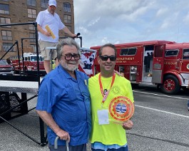 2023 Society for the Preservation and Appreciation of Antique Motor Fire Apparatus in America 4828 Dick Shappy receiving "Most Original Apparatus" trophy presented by David Pingatore.