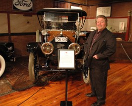 Larz Anderson Museum 2009 DSC_2972 Dick posing with his 1912 Cadillac which is currently on display at the Larz Anderson Museum of Transportation. It will be on display until April 2010.