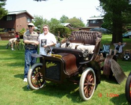 1906 Cadillac Model K Runabout 2006-06-21 DSC00835 Bob Wolfenseder (l) presenting Dick Shappy with the "President's Trophy" for his all original 1906 Cadillac Model "K" at the 2006 Cadillac LaSalle New England...