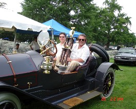DSC06027 Greg McDermott (L) and Dick Shappy (R) sitting in the 1912 Speedwell Speed Car with trophy in hand. The Speedwell had just been awarded "Best Of The World" at...