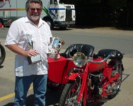 1920 Indian Power Plus Twin with Side Car Springfield 2003-07-20 ind03b Dick Shappy poses with the two trophies his 1920 Indian PowerPlus won on July 20, 2003 at the annual Indian motorcycle show held at the former Indian motorcycle...