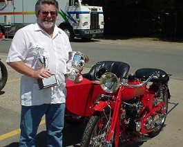 1920 Indian Power Plus Twin with Side Car Springfield 2003-07-20 ind03b Dick Shappy poses with the two trophies his 1920 Indian PowerPlus won on July 20, 2003 at the annual Indian motorcycle show held at the former Indian motorcycle...