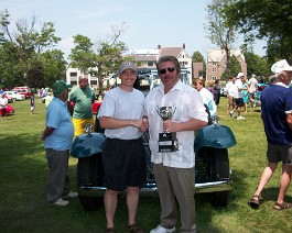 100_0822 President Chris Milici awards Dick Shappy "Best Of Show" trophy for his 1930 V-16 Convertible Sedan, New England Region of the Cadillac LaSalle on June 20,...